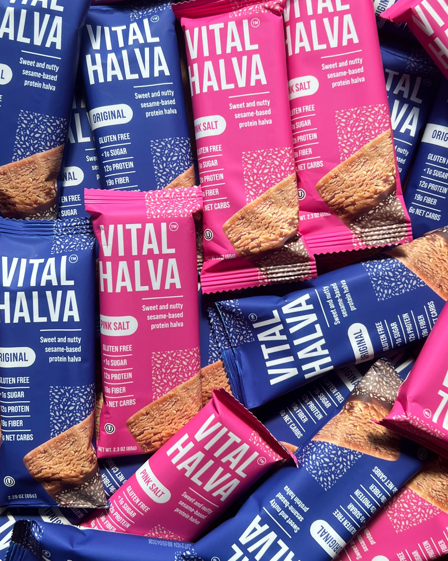Vital Halva bars in pink and blue packaging on a white background