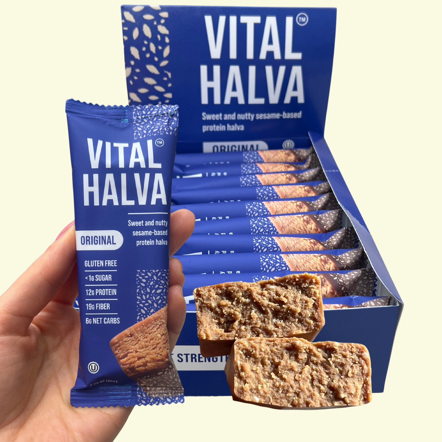 Vital Halva Original protein fiber snack bar with packaging and a hand holding a bar