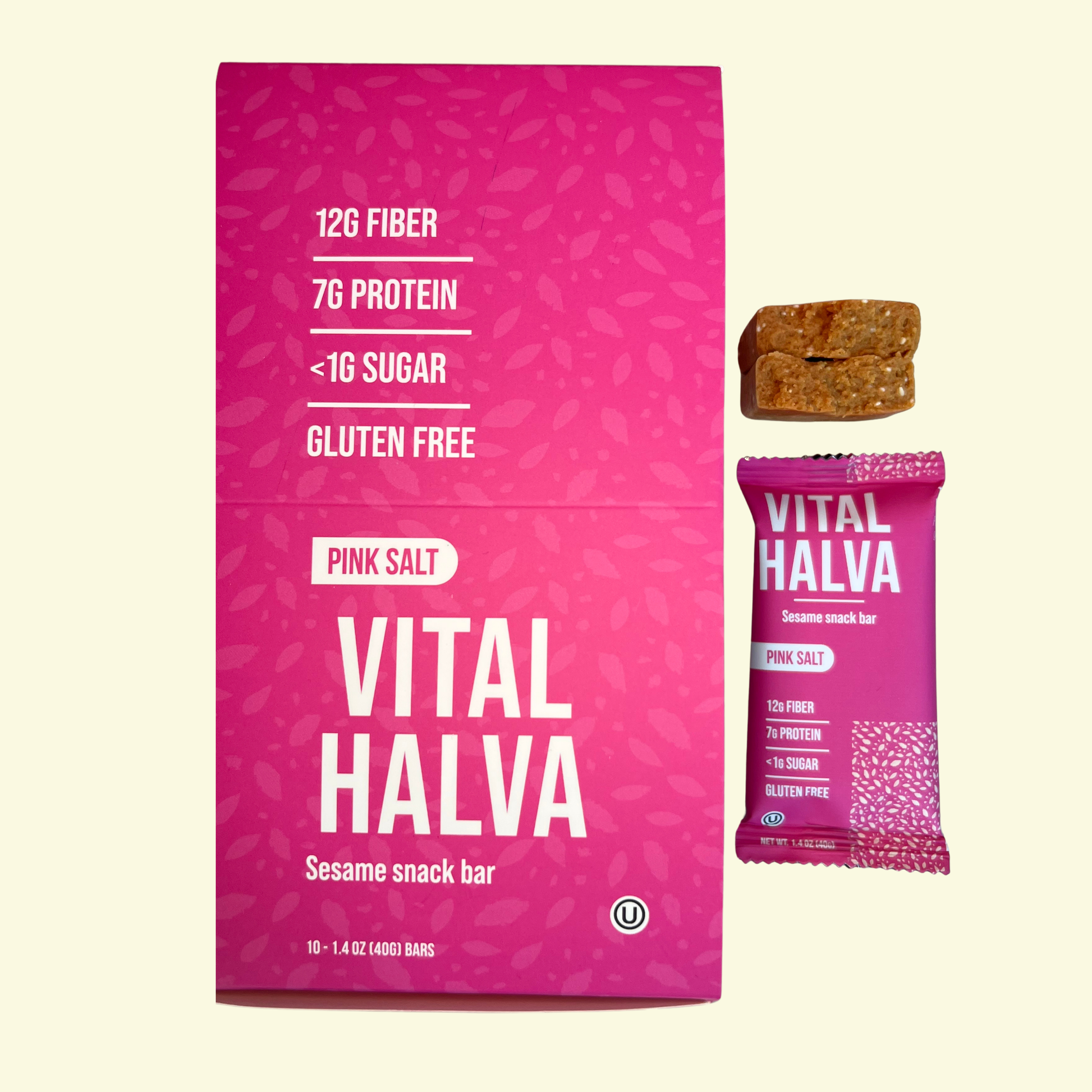 Pink packaging of Vital Halva sesame snack bars with a smaller pink package and a bar on a light yellow background.