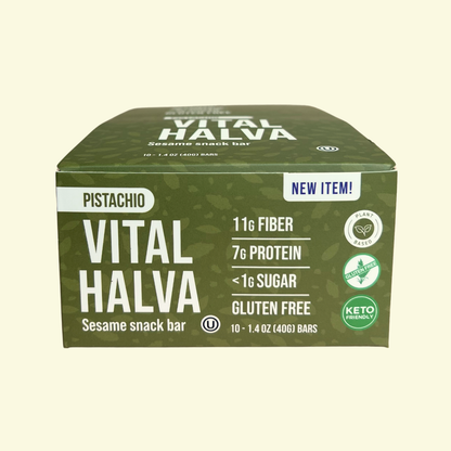 Box of Vital Halva pistachio sesame snack bars on a beige background